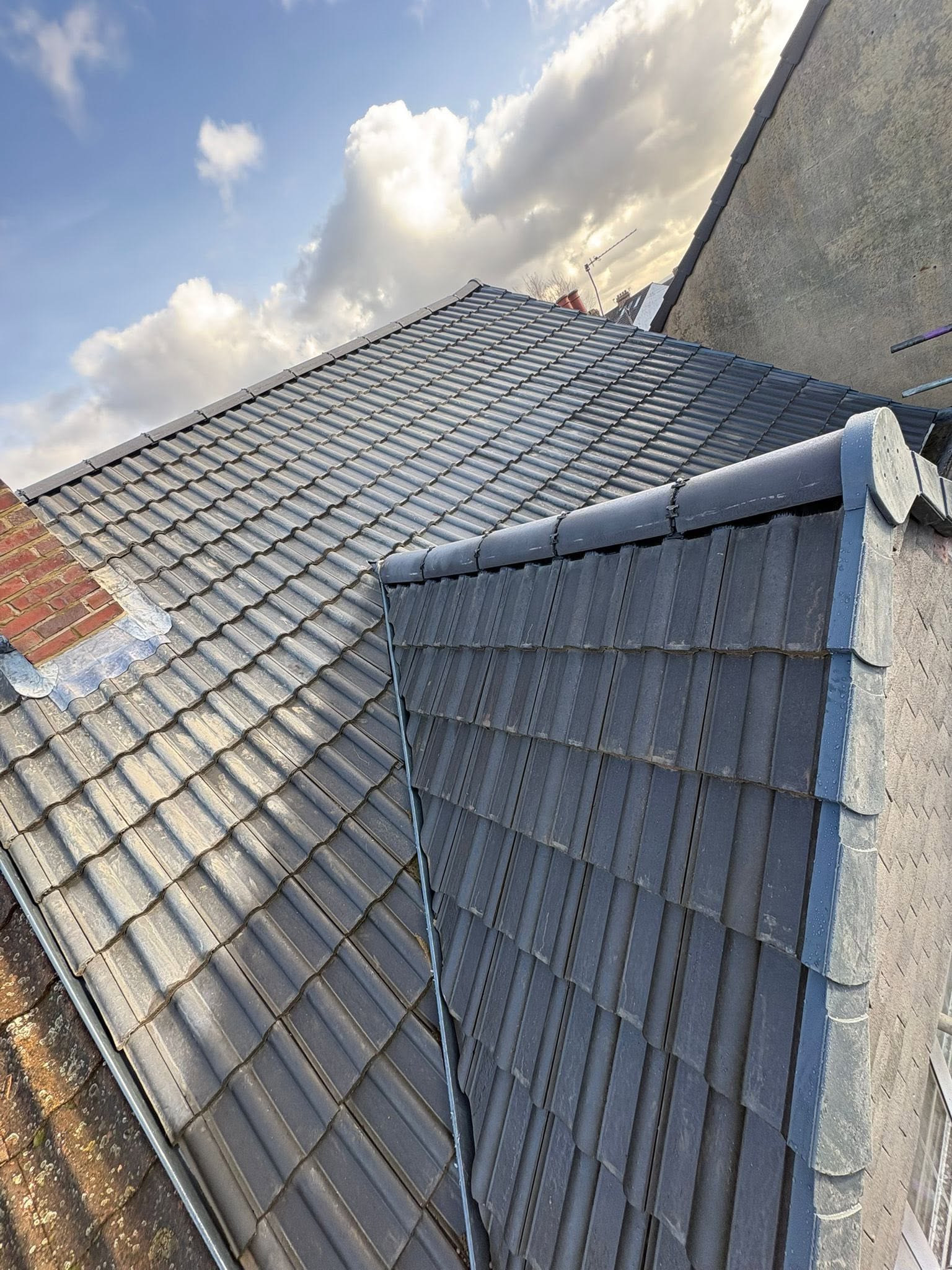 Finished dark tiled pitched roof